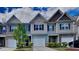 Three-unit townhouse exterior with two-car garage at 3635 Water Mist Ln, Raleigh, NC 27604