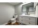 Modern bathroom with white vanity and quartz countertop at 1500 River Mill Drive Dr # 110, Wake Forest, NC 27587