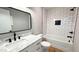Updated bathroom with white subway tile and marble countertop at 1500 River Mill Drive Dr # 110, Wake Forest, NC 27587