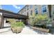 Community courtyard with stone building and plants at 1500 River Mill Drive Dr # 110, Wake Forest, NC 27587
