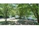 Relaxing riverfront view with Adirondack chairs at 1500 River Mill Drive Dr # 110, Wake Forest, NC 27587