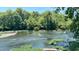 Serene view of a flowing river and lush greenery at 1500 River Mill Drive Dr # 110, Wake Forest, NC 27587