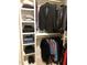 Well-organized closet with shelving for clothes and shoes at 2065 Pineola Bog Trl, Apex, NC 27502