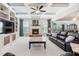 Bright living room featuring a fireplace and built-in shelving at 2065 Pineola Bog Trl, Apex, NC 27502