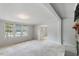 Living room with carpeting, windows, and view of other rooms at 1510 Logan St, Durham, NC 27704
