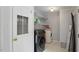 Laundry room with washer, dryer, and storage shelves at 1510 Logan St, Durham, NC 27704
