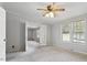 Spacious bedroom with large windows and ceiling fan at 1510 Logan St, Durham, NC 27704