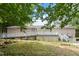 Elevated deck with ramp access overlooking a wooded backyard at 1510 Logan St, Durham, NC 27704