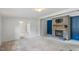 Living room with stone fireplace and view into adjacent rooms at 1510 Logan St, Durham, NC 27704