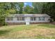 Single-story home with solar panels and landscaped yard at 1510 Logan St, Durham, NC 27704