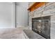 Stone fireplace with glass doors and wooden mantel at 1510 Logan St, Durham, NC 27704