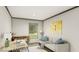 Home office with a desk, sofa, and large window at 369 Sombrero Ln, Henderson, NC 27537
