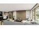 Spacious living room featuring a comfortable sofa and large windows at 369 Sombrero Ln, Henderson, NC 27537