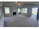 Spacious living room with vaulted ceiling, fireplace and carpet flooring at 78 Grace Ridge Ct, Benson, NC 27504