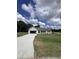 Ranch-style home with attached garage and landscaped lawn at 184 Grace Ridge Ct, Benson, NC 27504