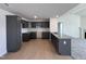 Well-equipped kitchen, featuring dark cabinetry and granite countertops at 184 Grace Ridge Ct, Benson, NC 27504