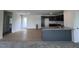 Modern kitchen with island, granite countertops, and wood flooring at 184 Grace Ridge Ct, Benson, NC 27504