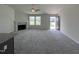 Spacious living room with fireplace and view of backyard at 184 Grace Ridge Ct, Benson, NC 27504