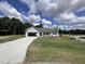 Ranch-style home with attached garage and landscaped lawn at 184 Grace Ridge Ct, Benson, NC 27504