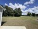 Spacious backyard with grassy lawn and tree line at 184 Grace Ridge Ct, Benson, NC 27504