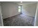 Well-lit bedroom with neutral walls and carpet flooring at 184 Grace Ridge Ct, Benson, NC 27504