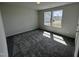Bright bedroom with neutral carpeting and two large windows at 184 Grace Ridge Ct, Benson, NC 27504