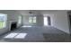 Spacious living room with fireplace, neutral carpet, and lots of natural light at 117 Grace Ridge Ct, Benson, NC 27504