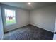 Simple bedroom with carpet flooring and a window at 117 Grace Ridge Ct, Benson, NC 27504
