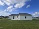 Rear view of house with patio and yard at 117 Grace Ridge Ct, Benson, NC 27504
