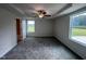 Main bedroom with ceiling fan and access to the bathroom at 117 Grace Ridge Ct, Benson, NC 27504