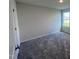 Bright bedroom with carpet flooring and large window at 117 Grace Ridge Ct, Benson, NC 27504