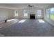 Spacious living room featuring a fireplace and large windows at 117 Grace Ridge Ct, Benson, NC 27504