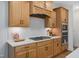 Well-equipped kitchen with gas range, custom cabinetry and a stylish backsplash at 226 Beacon Dr, Pittsboro, NC 27312