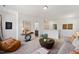 Open living space with comfortable seating and access to a small bathroom at 226 Beacon Dr, Pittsboro, NC 27312