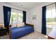 Bedroom with a daybed, blue bedding, and navy blue curtains at 226 Beacon Dr, Pittsboro, NC 27312