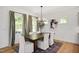 Elegant dining room with hardwood floors and a statement chandelier at 226 Beacon Dr, Pittsboro, NC 27312