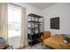 Bright home office features a window, built-in shelving, and a workspace at 226 Beacon Dr, Pittsboro, NC 27312