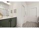 Bathroom with green vanity and black and white geometric tile floor at 226 Beacon Dr, Pittsboro, NC 27312