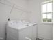 Laundry room with side-by-side washer and dryer, and overhead shelving at 226 Beacon Dr, Pittsboro, NC 27312