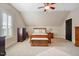 Comfortable bedroom with dresser, ceiling fan, and window with shutters at 90 Brandon Dr, Lillington, NC 27546