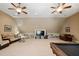 Bonus room with a pool table, built-in shelving, and seating area at 90 Brandon Dr, Lillington, NC 27546