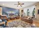 Bright living room with hardwood floors, comfortable seating, and access to backyard views at 90 Brandon Dr, Lillington, NC 27546