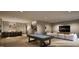 Finished basement with wet bar, pool table, and lounge area at 5428 Winding View Ln, Raleigh, NC 27615