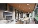 Covered patio with built-in grill, dining area, and fireplace at 5428 Winding View Ln, Raleigh, NC 27615