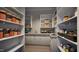 Well-organized pantry with ample shelving for storage at 5428 Winding View Ln, Raleigh, NC 27615