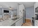 Open concept kitchen with granite counters and stainless steel appliances at 13671 Burgess Rd, Middlesex, NC 27557