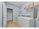 Laundry room with washer, dryer, and shelving for storage at 13671 Burgess Rd, Middlesex, NC 27557