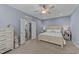 Bedroom with king-size bed, ceiling fan, and en-suite bathroom access at 13671 Burgess Rd, Middlesex, NC 27557