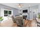 Relaxing living room featuring a fireplace, hardwood floors, and access to deck at 13671 Burgess Rd, Middlesex, NC 27557