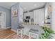 Kitchen boasts granite countertops, white cabinets, and a breakfast bar at 13671 Burgess Rd, Middlesex, NC 27557
